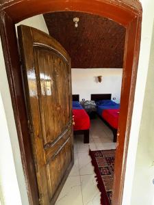 Voodi või voodid majutusasutuse Ajwa Guest House toas