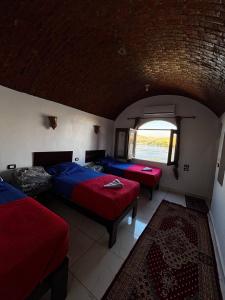 Voodi või voodid majutusasutuse Ajwa Guest House toas