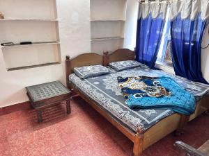 Postel nebo postele na pokoji v ubytování Priya guest house pushkar + 3 fotografie