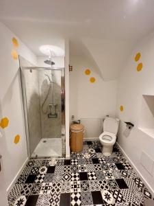a bathroom with a shower and a toilet at Seven Keys - Enclave du Coiron in Saint-Vincent-de-Barrès