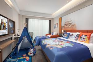 Postel nebo postele na pokoji v ubytování Hampton by Hilton Changsha Moon Island