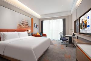 TV a/nebo společenská místnost v ubytování Hampton by Hilton Changsha Moon Island