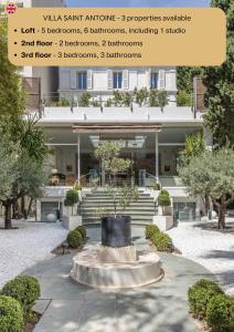 een gebouw met een standbeeld voor een gebouw bij Heart of Cannes Luxury Stay - Steps from Beach & Palais in Cannes