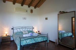 Postel nebo postele na pokoji v ubytování Agriturismo Cascina Aguzza