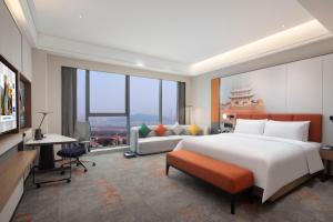 TV a/nebo společenská místnost v ubytování Hampton by Hilton Changsha Moon Island