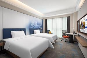 TV a/nebo společenská místnost v ubytování Hampton by Hilton Changsha Moon Island