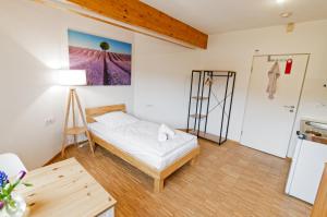 Ein Bett oder Betten in einem Zimmer der Unterkunft Boardinghouse Steinen