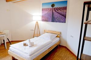 Ein Bett oder Betten in einem Zimmer der Unterkunft Boardinghouse Steinen