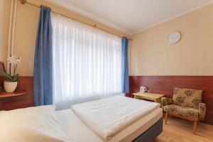 Ένα ή περισσότερα κρεβάτια σε δωμάτιο στο Sport Hotel Gejzirpark