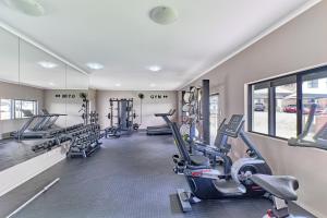 a gym with treadmills and cardio equipment in a building at Luxury Living at Canvas 82 Unit 129 in Four Ways