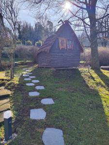 a stepping stone path in front of a cabin at La Grange in Birkenwald
