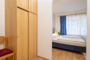Ένα ή περισσότερα κρεβάτια σε δωμάτιο στο Sport Hotel Gejzirpark