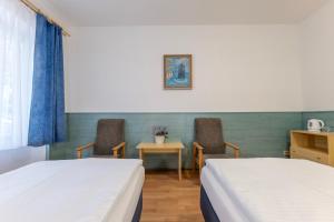Ένα ή περισσότερα κρεβάτια σε δωμάτιο στο Sport Hotel Gejzirpark