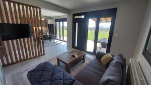 a living room with a couch and a table at P&M APARTMENT in Ioannina