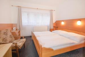 Ένα ή περισσότερα κρεβάτια σε δωμάτιο στο Sport Hotel Gejzirpark