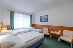 Ένα ή περισσότερα κρεβάτια σε δωμάτιο στο Sport Hotel Gejzirpark