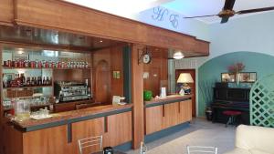 a bar with a counter in a room at Hotel Etrusco in Sesto Fiorentino