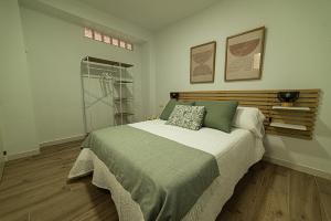 a bedroom with a large bed in a room at Casa Paca in Olvera