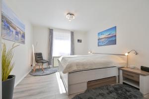 Postel nebo postele na pokoji v ubytování Fewo Mummel + 7 fotografií