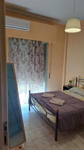 Posteľ alebo postele v izbe v ubytovaní Apartment Getaway in Sparti