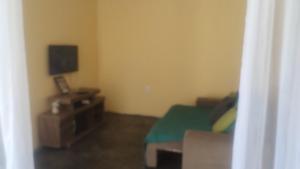 Televiisor ja/või meelelahutuskeskus majutusasutuses Hospedagem Tia Dete +17 fotot