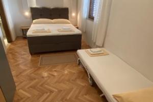 Posteľ alebo postele v izbe v ubytovaní Apartment 2