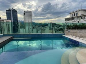 a swimming pool on the roof of a building at Refúgio carioca com piscina in Rio de Janeiro