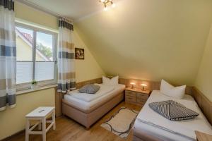 En eller flere senge i et værelse på Ferienhaus Ines