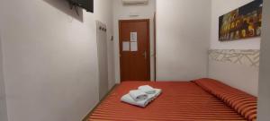 Postel nebo postele na pokoji v ubytování Palma Residences In Rome