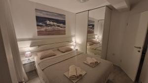 Postel nebo postele na pokoji v ubytování Apartments KUS Ugljan