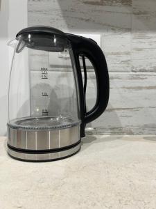 a black coffee pot sitting on a counter at Casa nel vicolo in Montichiari