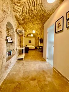 a hallway in a castle with a stone wall at Christian Quarter Studio I in Jerusalem +12 photos