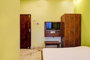 TV a/nebo společenská místnost v ubytování Super Hotel O The Orchid Residency