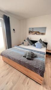 Ένα ή περισσότερα κρεβάτια σε δωμάτιο στο Lütje Eiland +9 φωτογραφίες