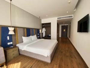 Ein Bett oder Betten in einem Zimmer der Unterkunft Apec Mandala Ocean Retreat - Mui Ne