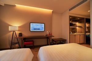 Ein Bett oder Betten in einem Zimmer der Unterkunft Apec Mandala Ocean Retreat - Mui Ne