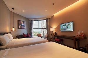 Ein Bett oder Betten in einem Zimmer der Unterkunft Apec Mandala Ocean Retreat - Mui Ne