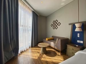 Ein Bett oder Betten in einem Zimmer der Unterkunft Apec Mandala Ocean Retreat - Mui Ne