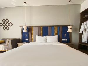 Ein Bett oder Betten in einem Zimmer der Unterkunft Apec Mandala Ocean Retreat - Mui Ne