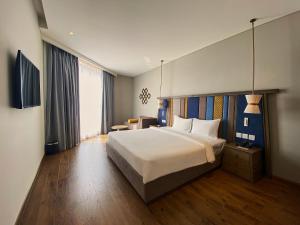 Ein Bett oder Betten in einem Zimmer der Unterkunft Apec Mandala Ocean Retreat - Mui Ne