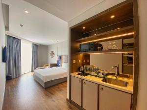 Ein Bett oder Betten in einem Zimmer der Unterkunft Apec Mandala Ocean Retreat - Mui Ne