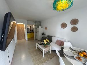 a living room with a white couch and a table at Hernando II in Calpe