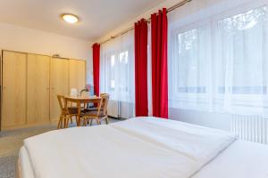 Ένα ή περισσότερα κρεβάτια σε δωμάτιο στο Sport Hotel Gejzirpark