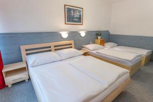 Ένα ή περισσότερα κρεβάτια σε δωμάτιο στο Sport Hotel Gejzirpark