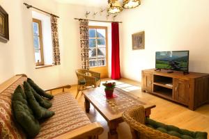 a living room with a couch and a table at Peter -806- in Mittenwald