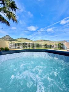 a swimming pool with a view of a city at Profetas GuestHouse in Porto Santo