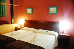 Cama o camas de una habitación en Hotel Puerto de Las Nieves