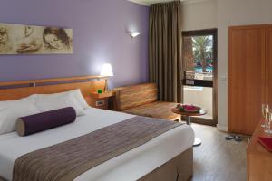 Postel nebo postele na pokoji v ubytování Leonardo Privilege Eilat Hotel - All inclusive