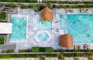 Der Swimmingpool an oder in der Nähe von Apec Mandala Ocean Retreat - Mui Ne