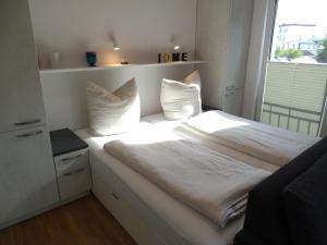 Postel nebo postele na pokoji v ubytování Lütt Plambeck-Appartement Helene DG 3